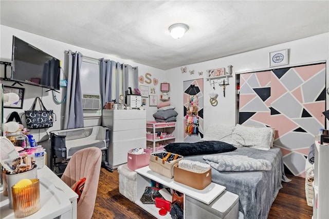 bedroom with dark hardwood / wood-style flooring