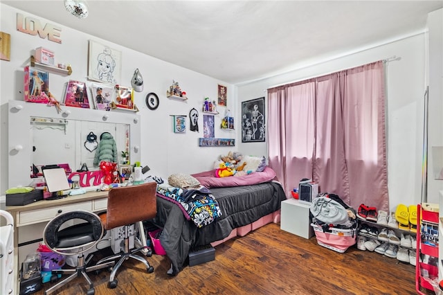 bedroom featuring dark hardwood / wood-style flooring