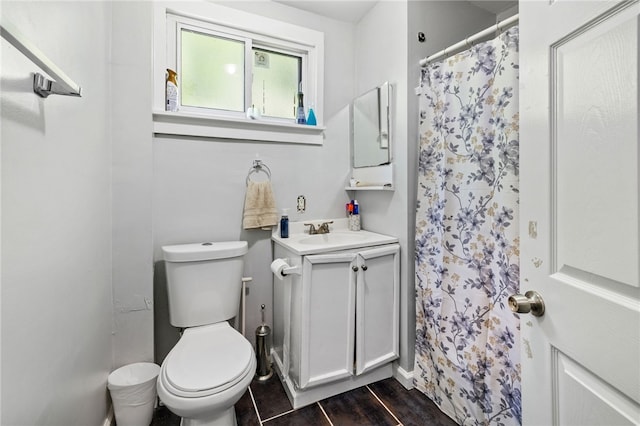 bathroom featuring wood-type flooring, vanity, and toilet