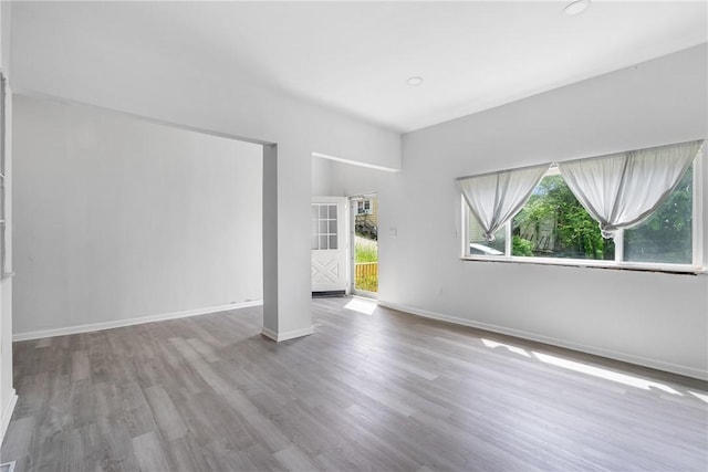 spare room with light hardwood / wood-style floors