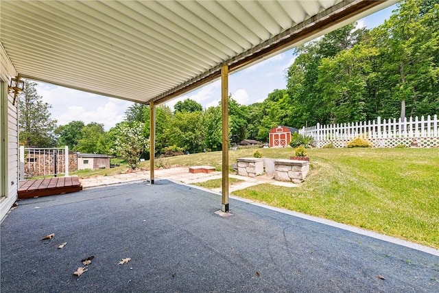 view of patio featuring a storage shed