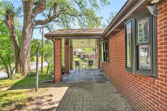 view of side of property with a patio