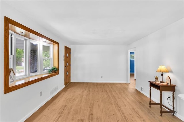 spare room featuring light hardwood / wood-style floors