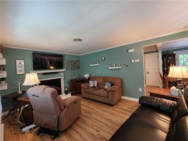 living room with hardwood / wood-style floors and ornamental molding