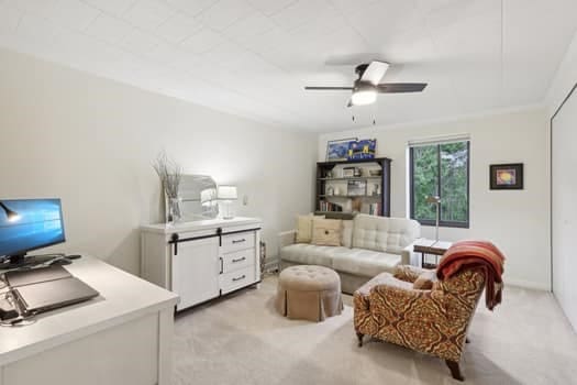 office featuring ceiling fan and light colored carpet