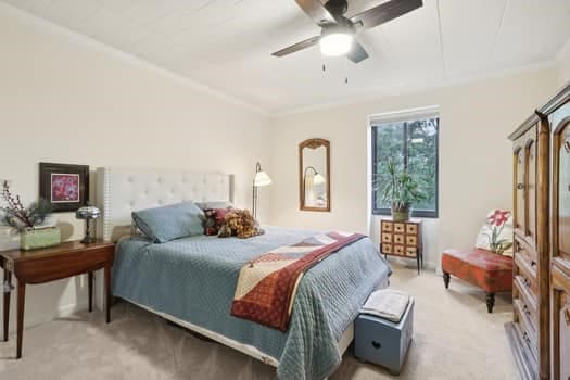 carpeted bedroom with ceiling fan