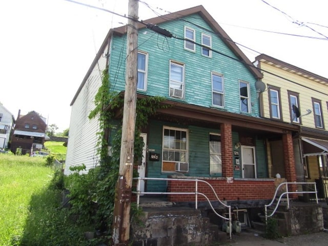 multi unit property with cooling unit and brick siding