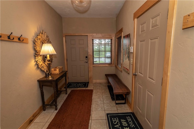 entrance foyer featuring light tile floors