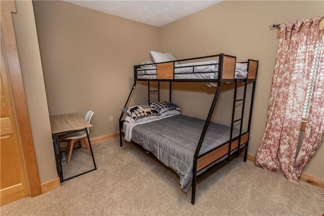 bedroom featuring carpet and multiple windows