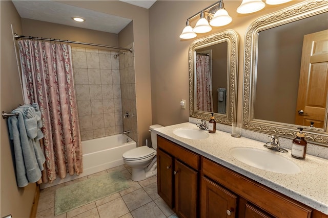 full bathroom with shower / tub combo, tile floors, vanity with extensive cabinet space, toilet, and dual sinks