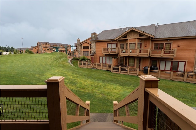 view of yard featuring a balcony