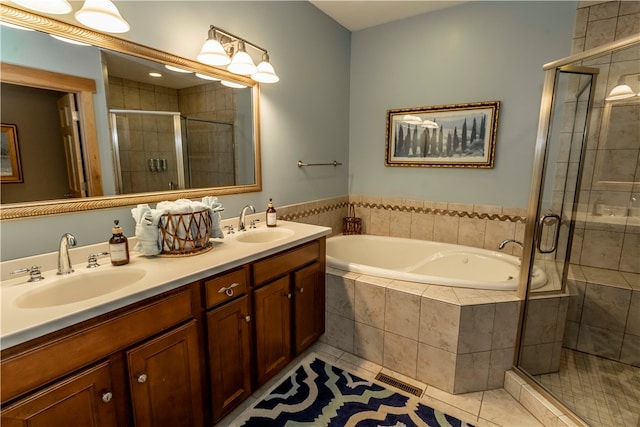 bathroom with tile floors, shower with separate bathtub, and double vanity