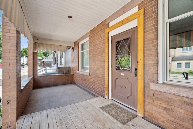 doorway to property with covered porch