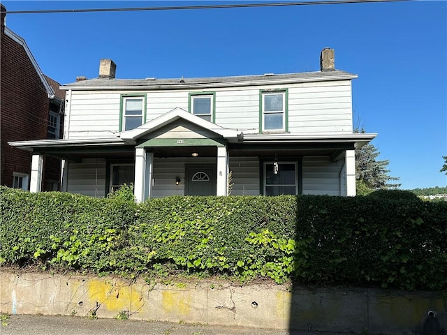 traditional-style house with a chimney