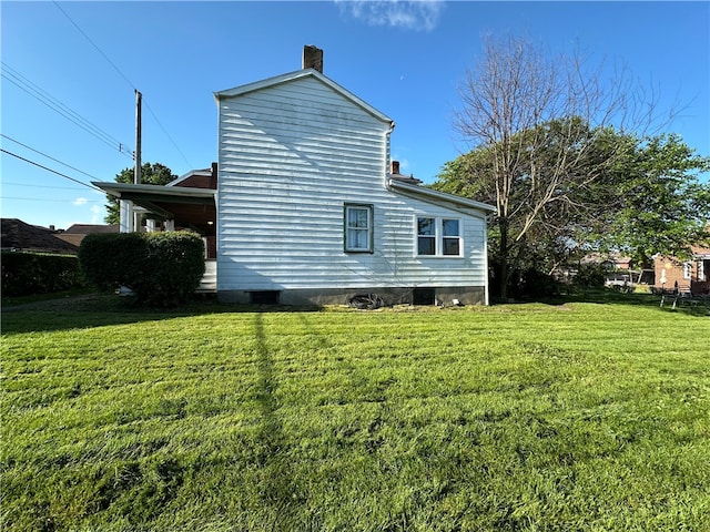 view of property exterior featuring a lawn