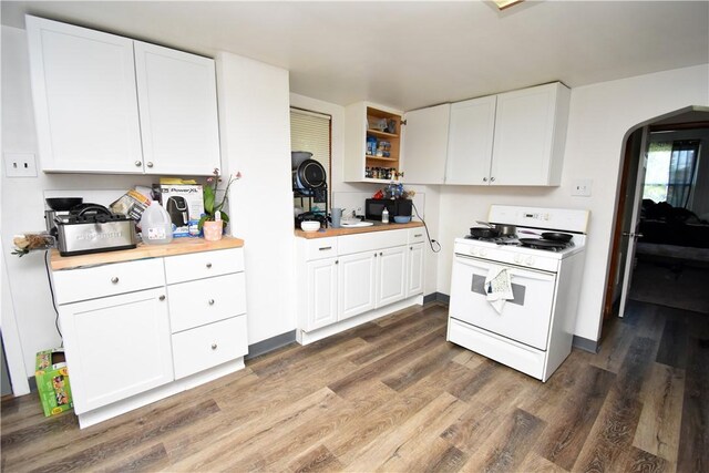 kitchen featuring wooden counters, white cabinetry, white range with gas cooktop, and dark hardwood / wood-style flooring