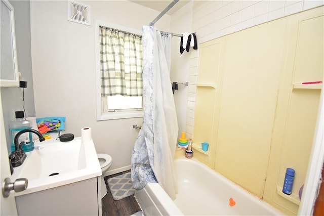 full bathroom with shower / bathtub combination with curtain, wood-type flooring, vanity, and toilet