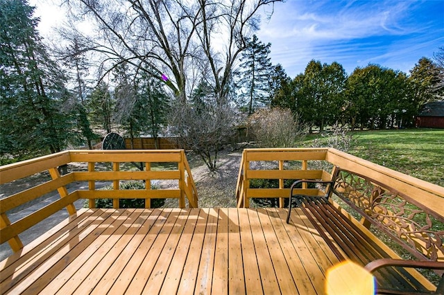 wooden terrace with a yard and a fenced backyard