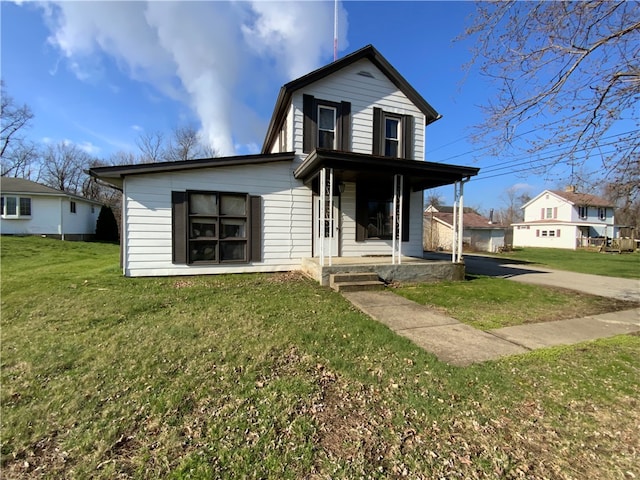 view of front of home with a front lawn and covered porch