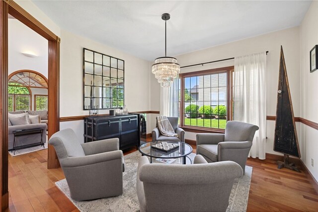 living room featuring hardwood / wood-style floors and a chandelier