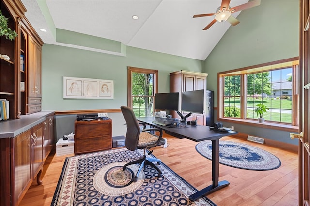 office area featuring high vaulted ceiling, ceiling fan, and light hardwood / wood-style flooring