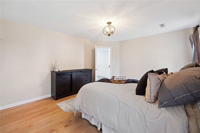 bedroom with light wood-type flooring