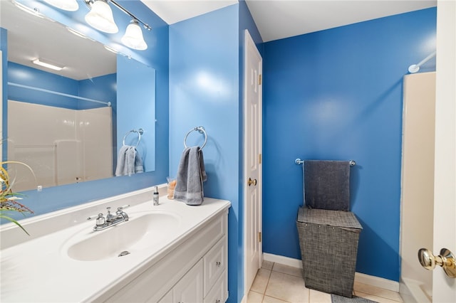 bathroom with tile flooring and large vanity