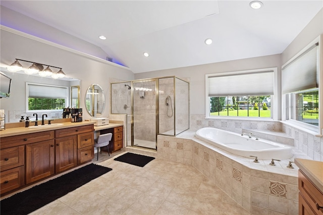 bathroom with tile flooring, separate shower and tub, and vanity