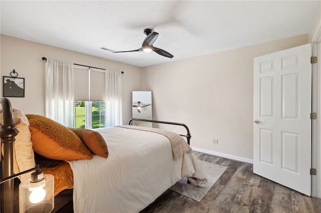 bedroom featuring dark wood-type flooring and ceiling fan