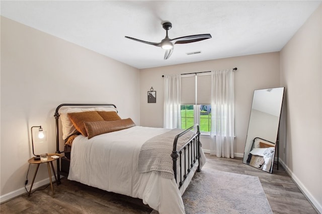 bedroom featuring ceiling fan and wood-type flooring