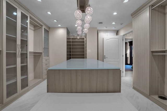 spacious closet featuring light tile floors