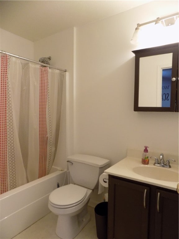 full bathroom featuring tile patterned flooring, vanity, shower / bath combo with shower curtain, and toilet