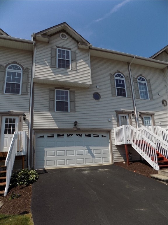 townhome / multi-family property featuring a garage