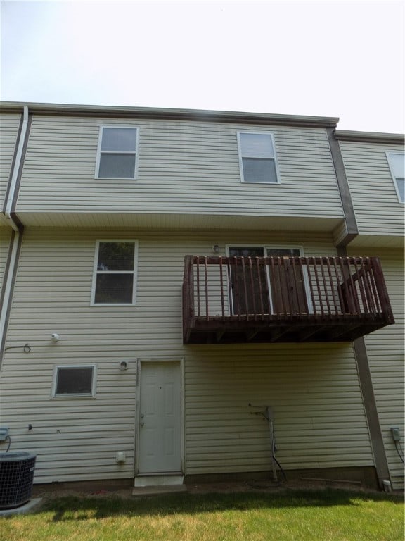 rear view of property with a balcony