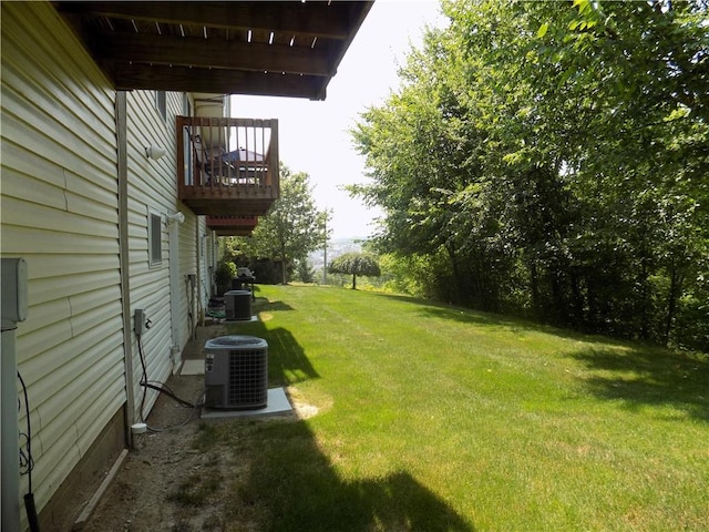 view of yard with central air condition unit