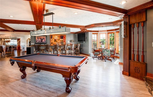 rec room featuring wood finished floors, coffered ceiling, a community bar, billiards, and crown molding