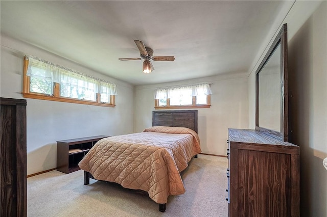 bedroom with light colored carpet and ceiling fan