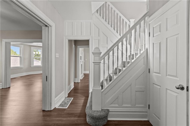 staircase featuring hardwood / wood-style flooring