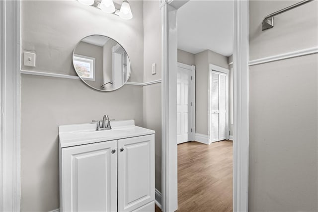 bathroom featuring wood-type flooring and vanity