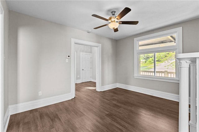 unfurnished room featuring dark hardwood / wood-style floors and ceiling fan