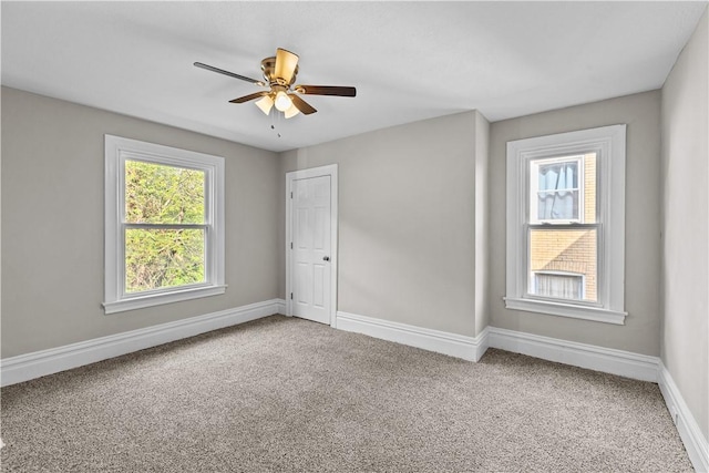 unfurnished room featuring carpet and ceiling fan