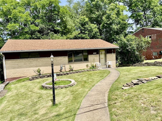 ranch-style home featuring a front yard