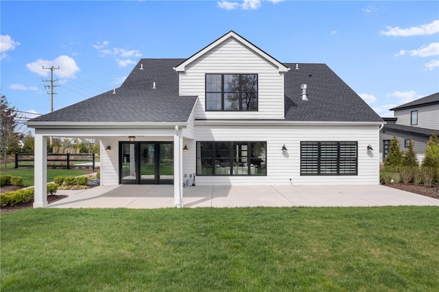 back of house featuring a patio and a lawn