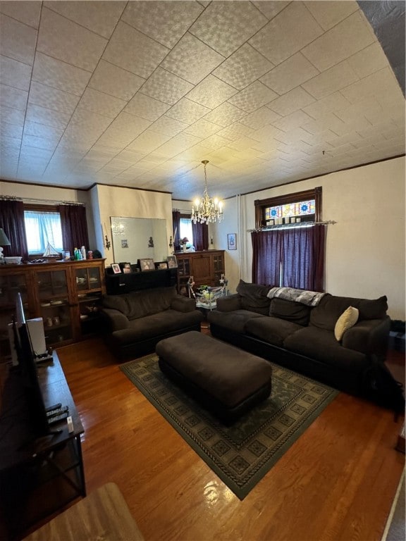 living room featuring hardwood / wood-style floors and a chandelier