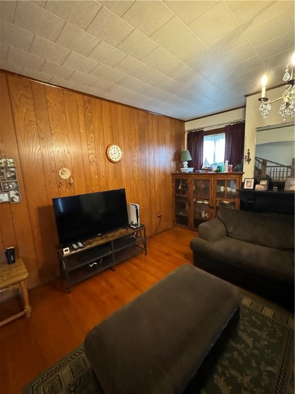 living room featuring wooden walls and wood-type flooring