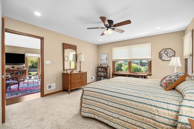 bedroom with access to exterior, ceiling fan, and carpet