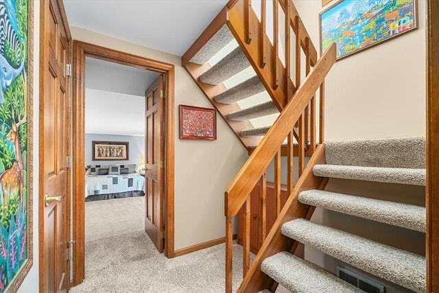 staircase with carpet flooring