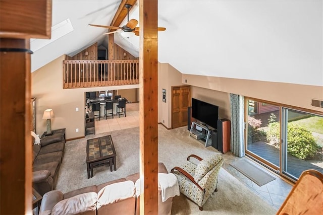 tiled living room with ceiling fan and lofted ceiling