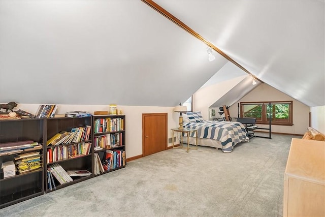 bedroom featuring carpet flooring and vaulted ceiling