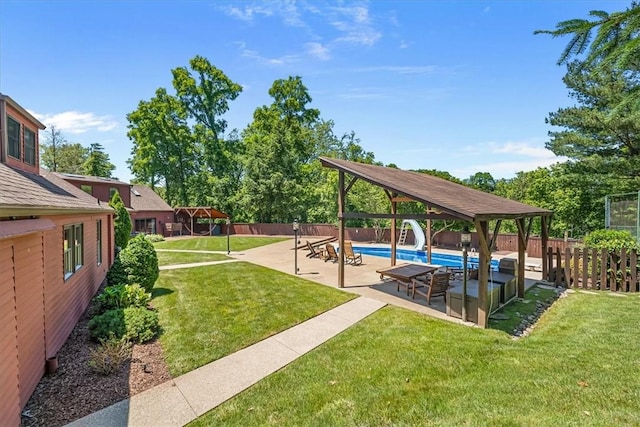 view of yard featuring a gazebo, a patio, and a fenced in pool